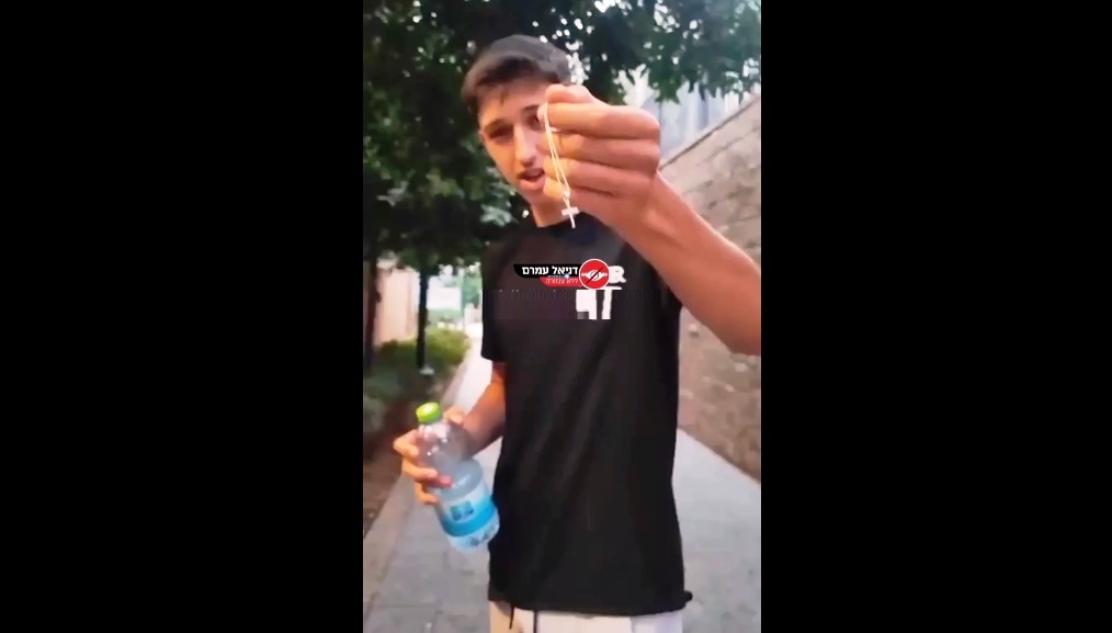 “You are not Israeli.” In Natanya, an Israeli settler chased Christian tourists, snatching their Christian cross necklace, throwing it on the ground, and spitting in their faces for wearing it in “Israel”